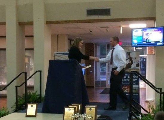 Dr. Agnich (Left) presented the first place award to Jack Lightfoot (Right) following the first annual internal mediation competition at Georgia Southern University